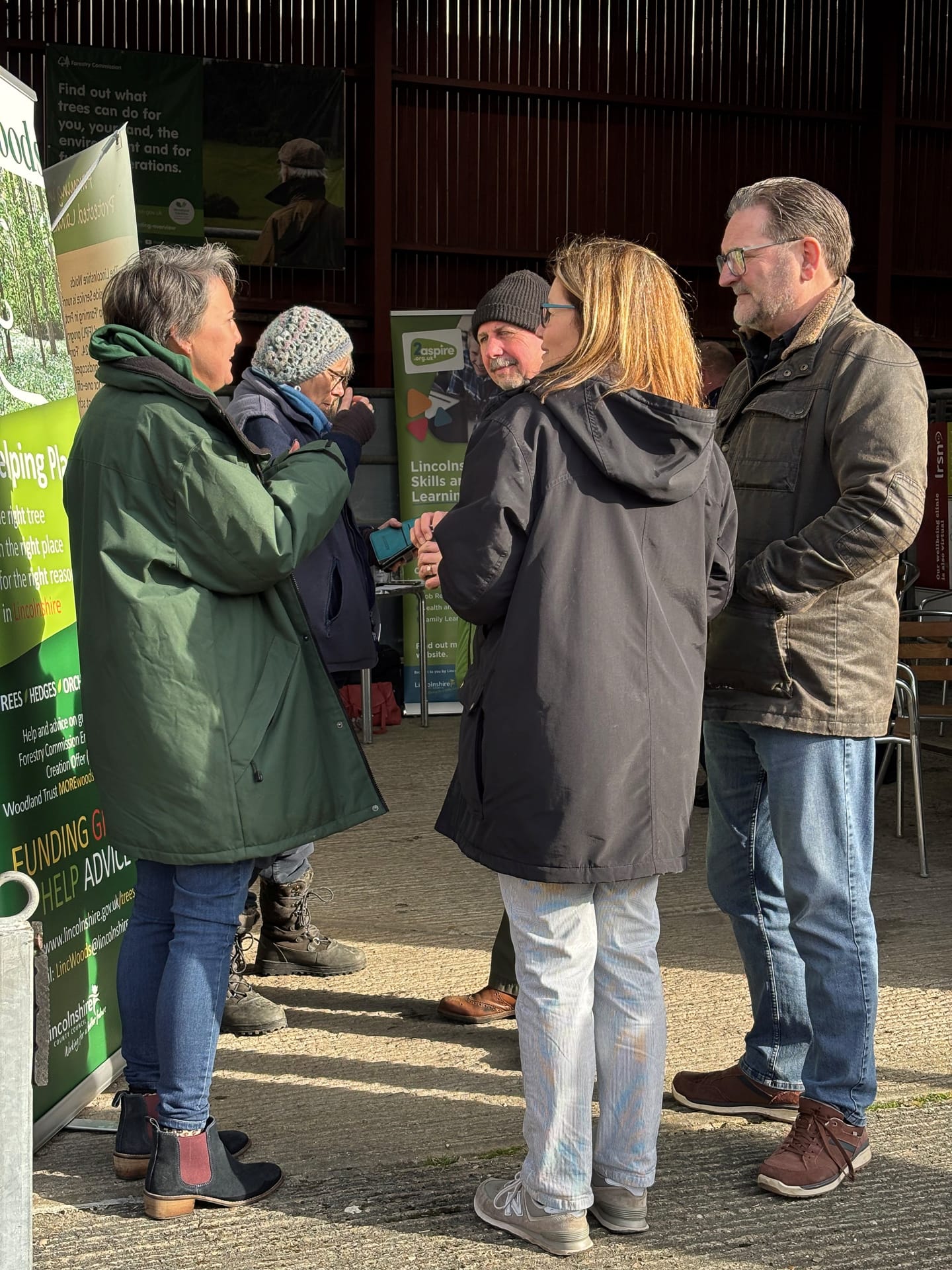 A group of people talking at a breakfast event
