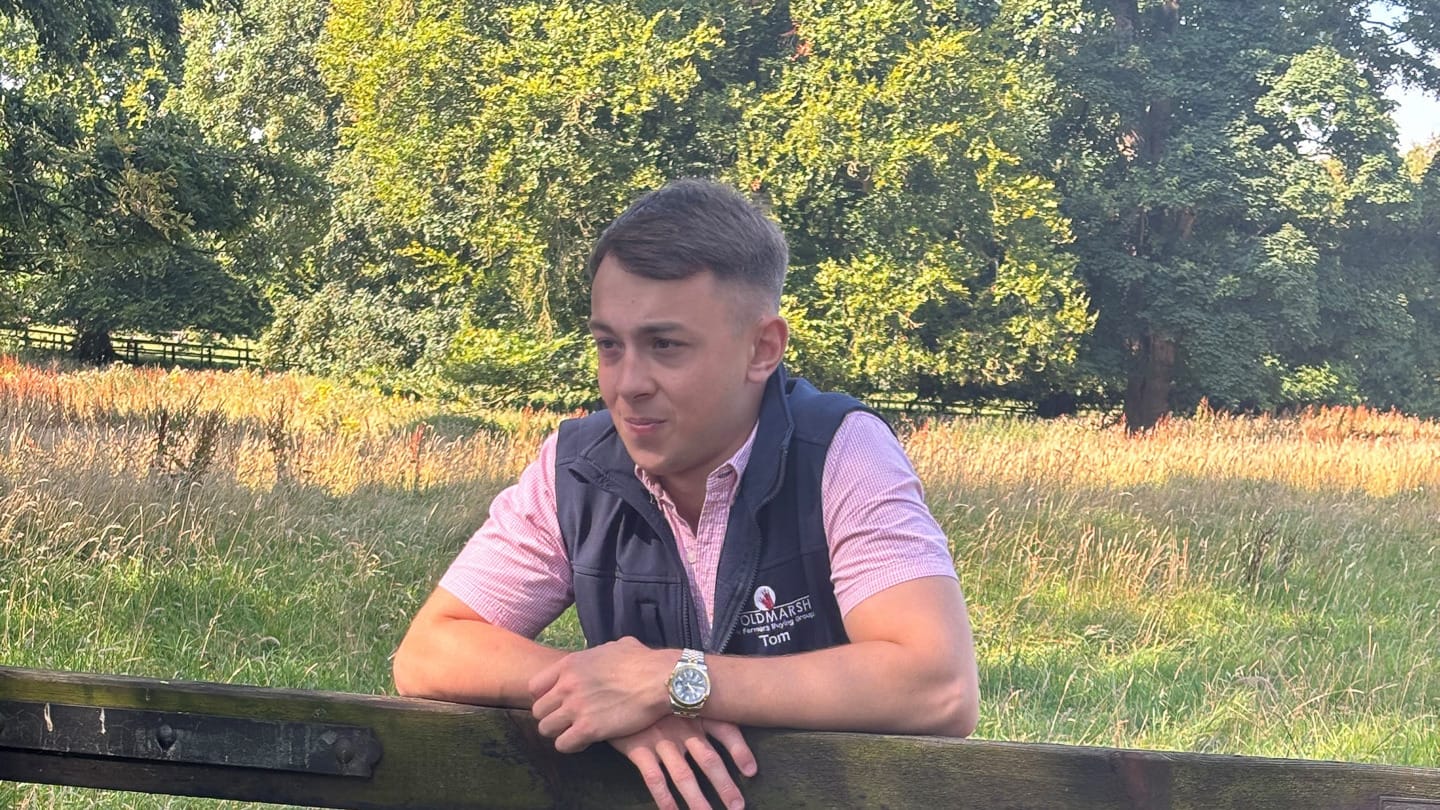 Tom Watson leaning against a fence wearing a Woldmarsh bodywarmer